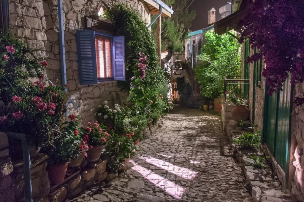 Lania village cobbled stone greenery street small outhentic windows